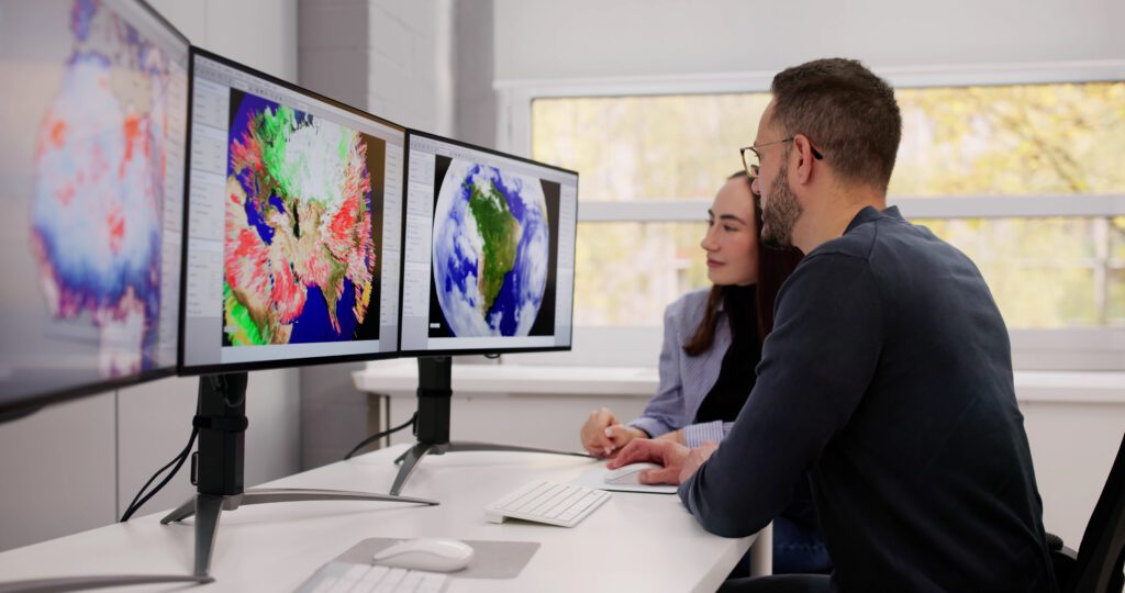 AI for climate action. Global Warming Forecast: Meteorologists Analyzing Weather Data In Office.